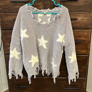 Silver/grey sweater with star detailing